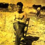 Donald Delves sitting on a chair from one of the blown up buildings half way between Salerno and Naples