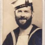 "Victory Postcard" in the form of a photograph of William Arthur Robinson (Bill) sporting a "full set" and sent to his wife, Kathleen, from Australia.