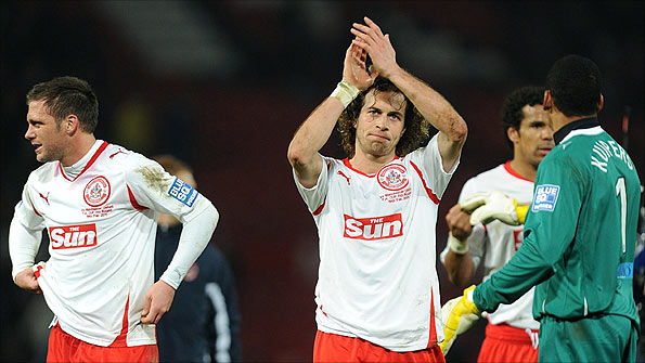 Crawley Town's Sergio Torres is applauded as the minnows run Man Utd close