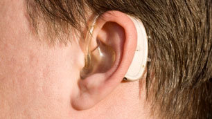 Person wearing an external hearing aid