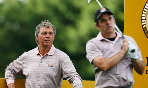 Darren Clarke watches Paul McGinley tee off during practice for the 2006 Ryder Cup
