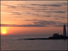 Sunrise behind St Mary's lighthouse