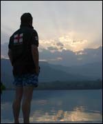 Ade watches the setting sun