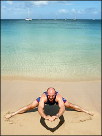 Paul Nixon stretches on the sand - Getty