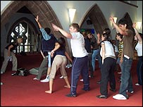 Youth theatre group dancing at rehearsal