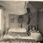 This one of the boys 'CHAPAI' String Bed and Wooden Frame. Cool in the heat but B'#*#Y cold in the winter. Tin Hat is always to hand also water bottle, Note Mosquito net above bed, folded. It looks pretty good on the snap. Assam 1943