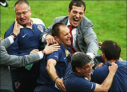 Bilic celebrates with his backroom team