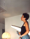 Anne looking at hanging wires from the ceiling