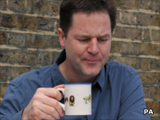 Nick Clegg drinking from a mug on April 11, 2010