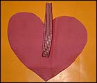Picture: Take some ribbon and place the folded end inside the heart