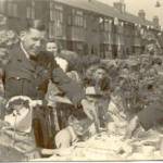 My husband Bill Edwards on the left as guest of honour cutting the cake, our son Paul is just to his right