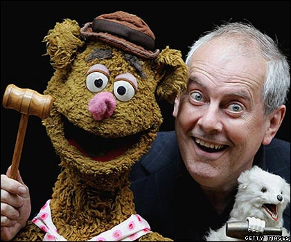 Gyles Brandreth poses with the original Fozzie Bear given to him by Muppets' creator Jim Henson.