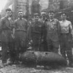Bomb Disposal in the North-East 14 October 1941. Showing the crew and a defused bomb.