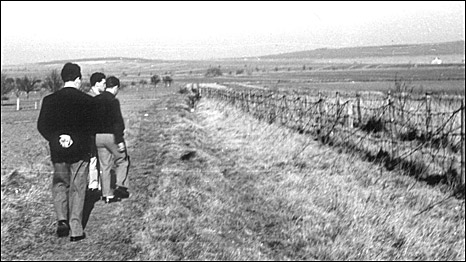 Tourists view the Austrian Hungarian border