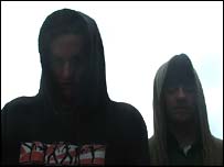 Silhouette of hood-wearing boys