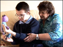 Claire Knox helps her son