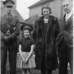 At 19 Palfrey Close St Albans April 1940. L.to R : 2/Lt Ian Millar RE, Christine Cockle (aged 8 - and loved parading around with my uniform hat and swagger stick!) Mrs Cockle , Mr Cockle.