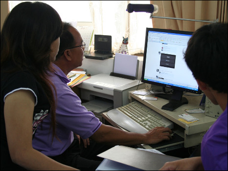 Residents looking at Facebook