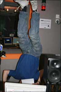 Bob Watson reading while standing on his head