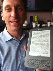 Man holding Kindle
