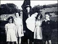 Black and white photo of Isobel with some of her family in 1940