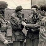 Taken in the UK on 28 September 1944. The 3 AFPU photographers who took the still and cine pictures of the 1st Airborne Div epic fight at Arnhem. L-R: Sgt's Lewis, Smith and Walker