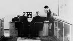 Alan Turing with two colleagues and a Ferranti computer in January 1951. Turing had previously been involved with the construction of both the Colossus and, later, the Automatic Computing Engine.