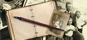 A pen on an open diary with black and white photos of family members scattered around