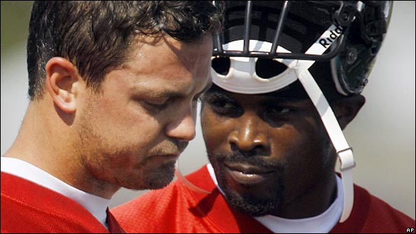 Rival quarterbacks Kevin Kolb and Michael Vick