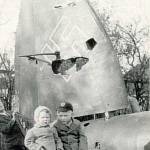 My sister Jean and I sitting on the tailplane of Heinkel 111. Picture taken 4th Nov. 1940, at Botwell Green Hayes Middx.