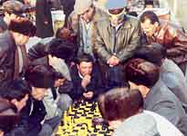 Xinjiang - China - people playing chess in street