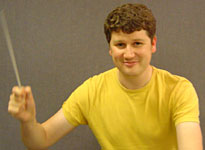 Presenter Tom Service conducts...