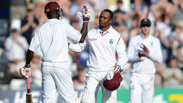 Marlon Samuels (right) is congratulated by Darren Sammy