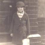 Coming home from school, standing on the doorstep with my gas mask in the paper carrier bag.