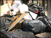 Rubbish littering a street.