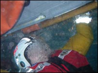 Martin Andrew under water, taking part in capsize training at Lifeboat College in Poole, Dorset. Photo: RNLI 