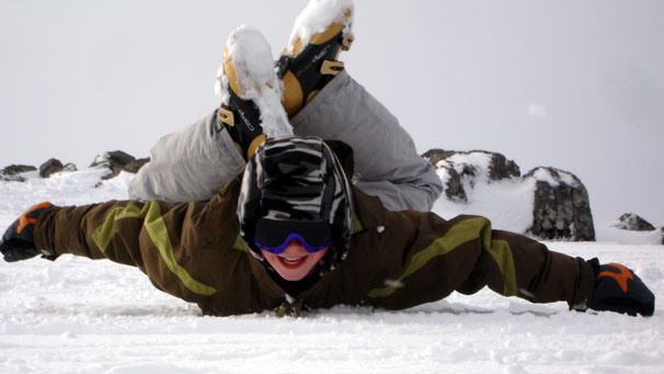 Action shot of Conor Sanderson playing in the snow