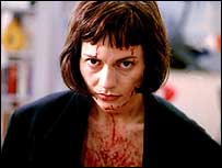 Woman covered in blood