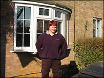 Heidi outside her home