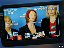 Screen shows Julia Gillard flanked by fellow candidates