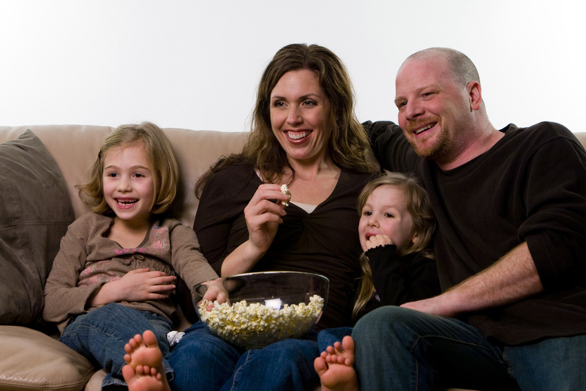 happy family watching a movie @ Mat Hayward - fotolia