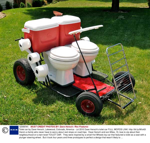 A vehicle with two toilet seats to sit on while driving.