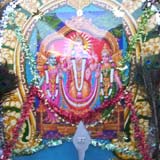 Representation of Murugan, hung with decorations, beads and feathers