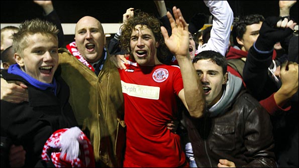 Sergio Torres celebrates his winner with the Crawley fans