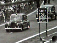 Royal car makes its way past toll sign