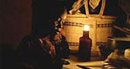 Studying by candlelight
