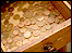 Copper coins in a wooden drawer