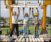 Workmen construct the Big Wheel