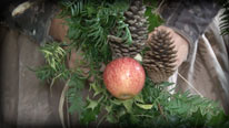 Attach fruit and pinecones