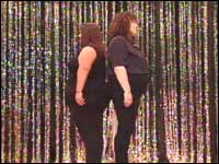 Two 'apple shaped' ladies standing back to back